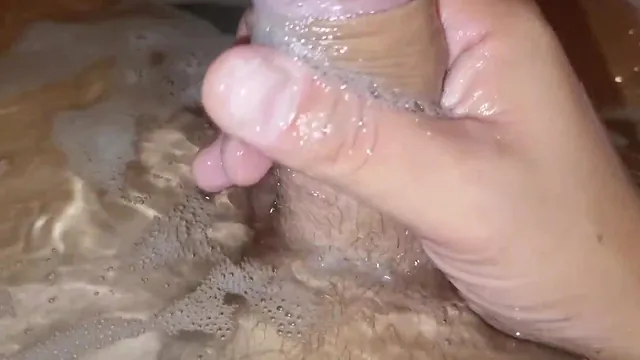 Stepmom has Alexander Audran over and he strokes his big cock in her tub
