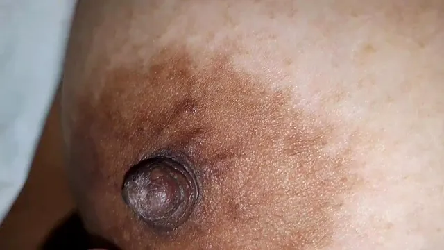 Miss Latin Rain squeezes big nipples on big breasts