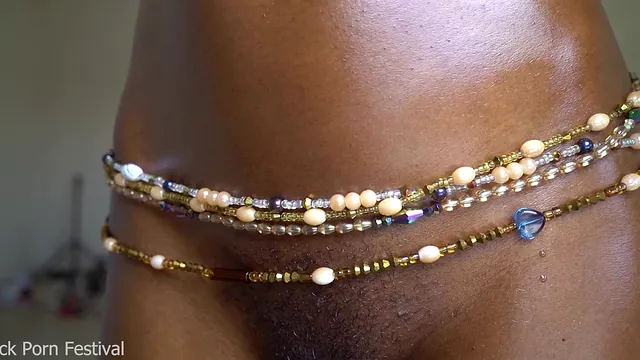 Dolcina shows off oiled very dark skin and a slim body with great tits