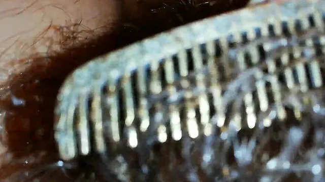 Underwater close up of a very hairy bush in a solo fetish clip