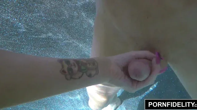 Tattooed MILF Romi Rain Goes Underwater for a Wet Pool Blowjob