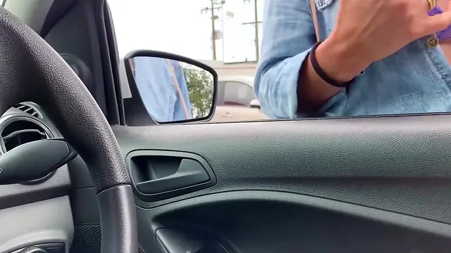 A handjob from Jane R in a busy parking lot ends in a cumshot
