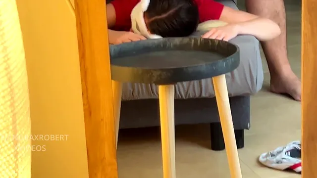 Friends have sex on the sofa with someone nearby in the kitchen