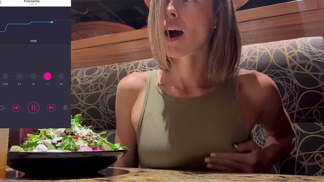 A woman reaches orgasm in a public restaurant with a Lush vibrator on remote