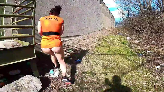MILF on a prison escape, bottomless outdoors with a butt plug in