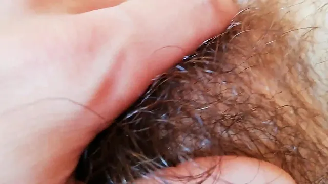 Close up of a hairy couple fucking with a big clit and a cumshot