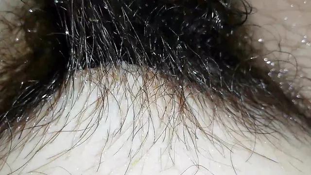 Very bushy hairy pussy shown up close under the water in a fetish clip
